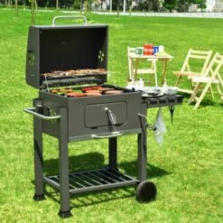 BIGZZIA Barbecue Grill - Barbecue Charbon De Bois à 2 Roues 2 Grilles Et 1 Thermomètre En Métal - Barbecue Au Charbon De Bois Avec Tablette Latérale Et Crochet Pour La Cuisine En Extérieur